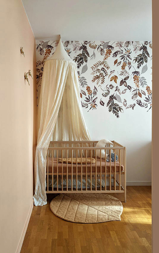 Contemporary nursery in Grenoble with light hardwood floors and wallpaper.