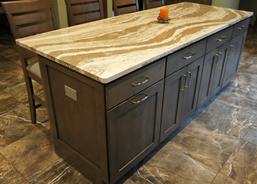 Example of a large transitional l-shaped ceramic tile and gray floor eat-in kitchen design in Bridgeport with a double-bowl sink, shaker cabinets, medium tone wood cabinets, quartz countertops, gray backsplash, ceramic backsplash, stainless steel appliances and an island