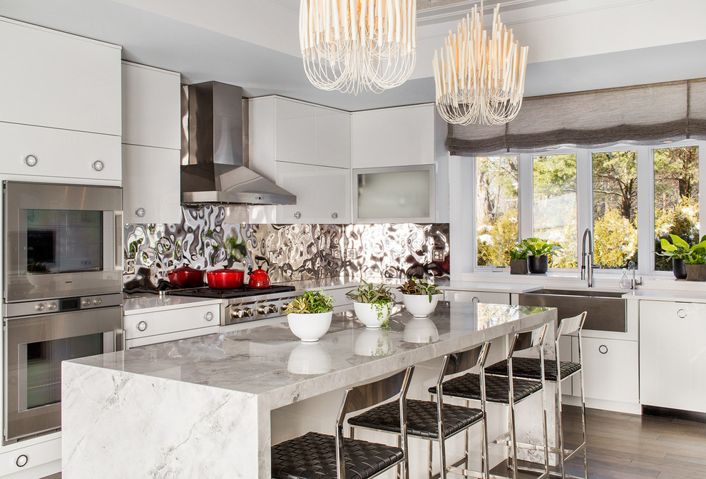 Inspiration for a contemporary l-shaped kitchen in Boston with flat-panel cabinets, white cabinets, metallic splashback, metal splashback and with island.