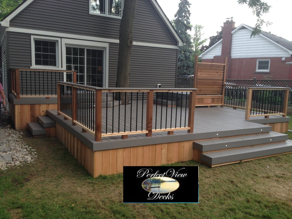 Azek tahoe deck around tree with cedar railing,privacy and skirt