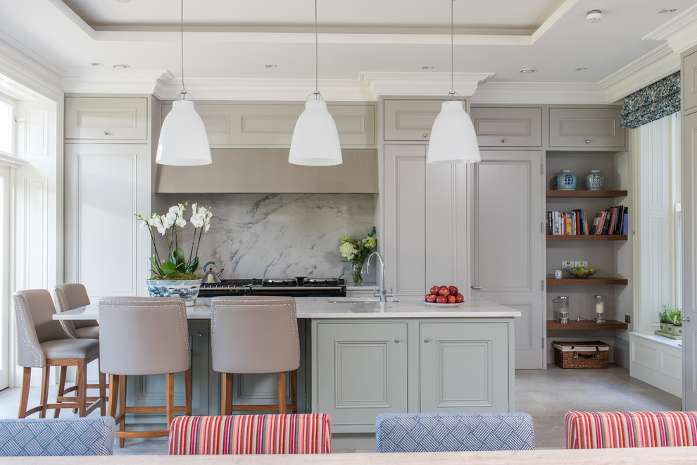 Traditional single-wall eat-in kitchen in Surrey with an integrated sink, recessed-panel cabinets, grey cabinets, marble benchtops, multi-coloured splashback, marble splashback, black appliances, porcelain floors, with island, grey floor and white benchtop.