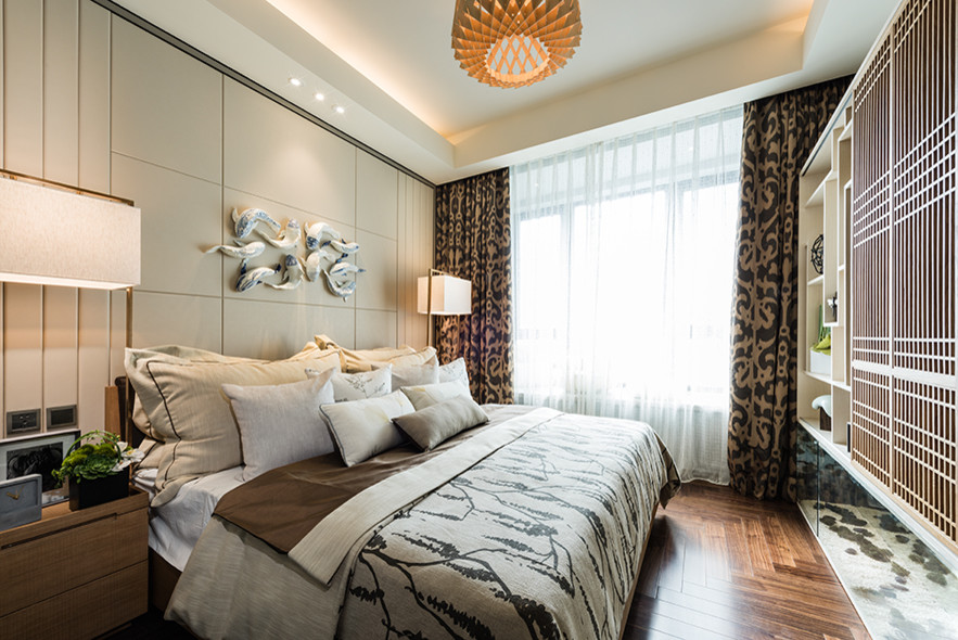 Design ideas for a mid-sized asian master bedroom in Singapore with beige walls and dark hardwood floors.