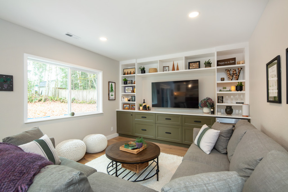 Inspiration for a mid-sized transitional open concept family room in Seattle with beige walls, medium hardwood floors, no fireplace and a built-in media wall.