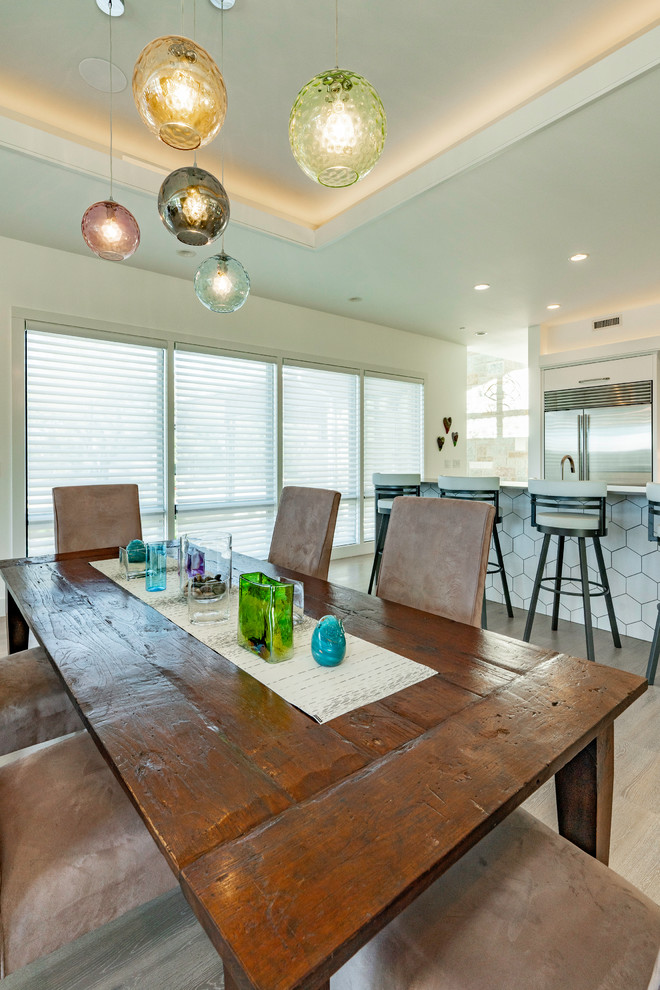 Large traditional open plan dining in Austin with beige walls, medium hardwood floors and beige floor.