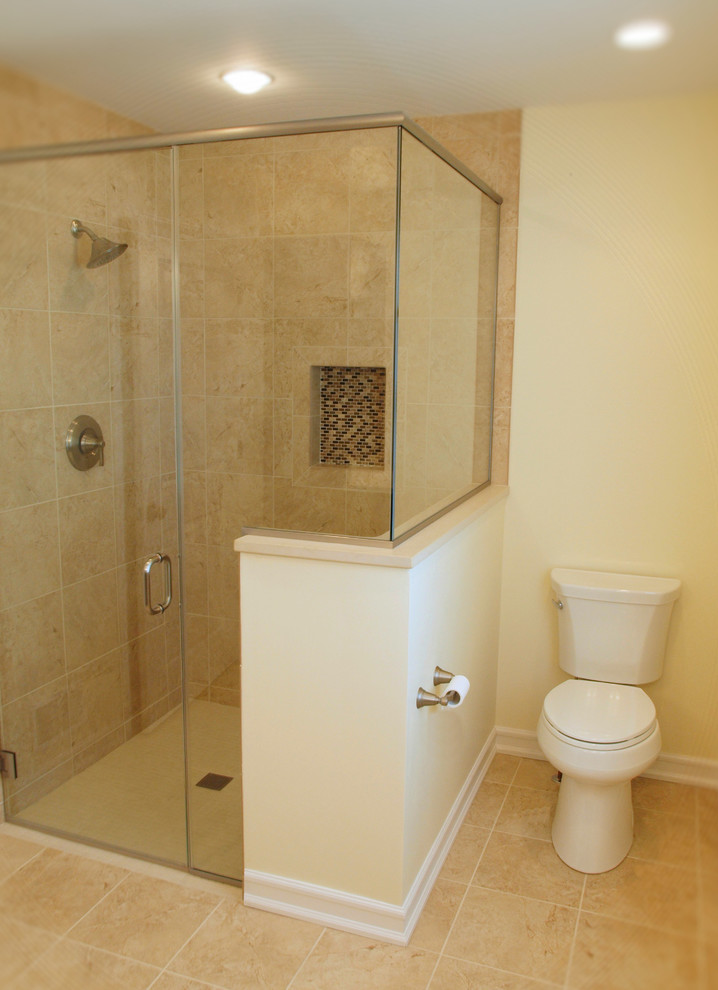 Design ideas for a mid-sized traditional master bathroom in Other with an alcove shower, a two-piece toilet, multi-coloured tile, mosaic tile, beige walls and limestone floors.