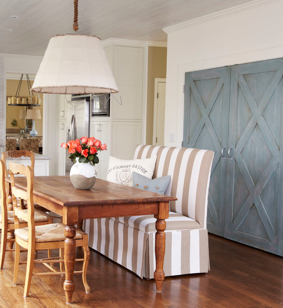Eat-in kitchen - country u-shaped eat-in kitchen idea in Atlanta with a farmhouse sink, shaker cabinets, white cabinets, granite countertops, gray backsplash and stainless steel appliances