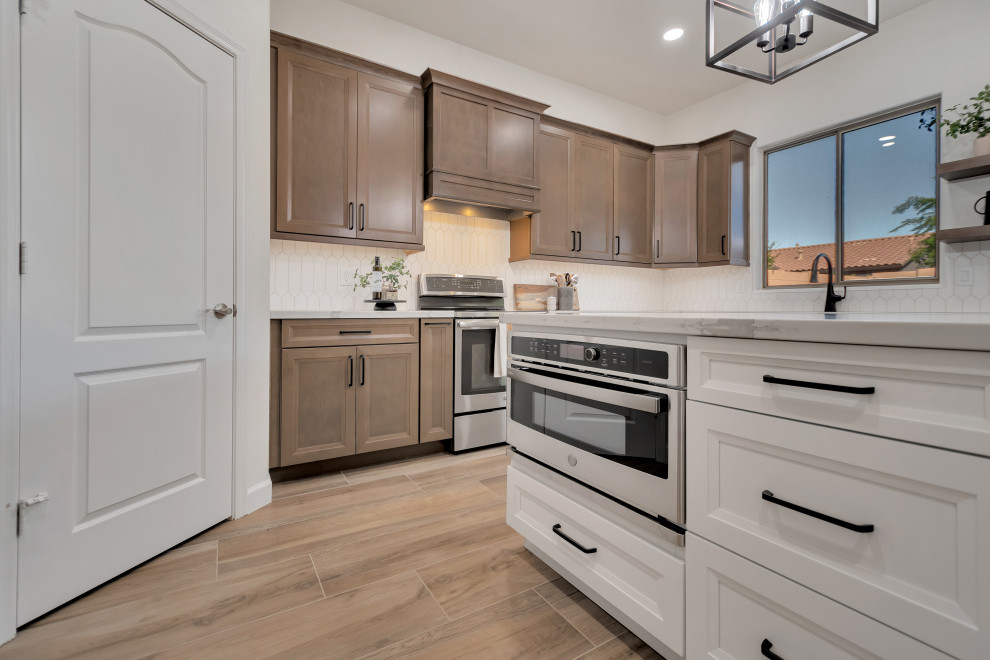 Mid-sized transitional u-shaped ceramic tile and brown floor eat-in kitchen photo in Phoenix with beaded inset cabinets, brown cabinets, quartzite countertops, white backsplash, ceramic backsplash, an island and white countertops