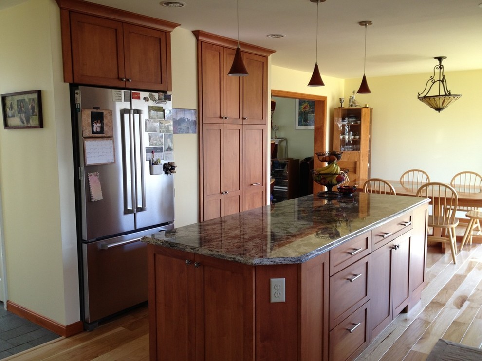 Eat-in kitchen - mid-sized transitional galley light wood floor eat-in kitchen idea in Burlington with shaker cabinets, dark wood cabinets, granite countertops, an island, multicolored backsplash, stone slab backsplash, stainless steel appliances and a double-bowl sink