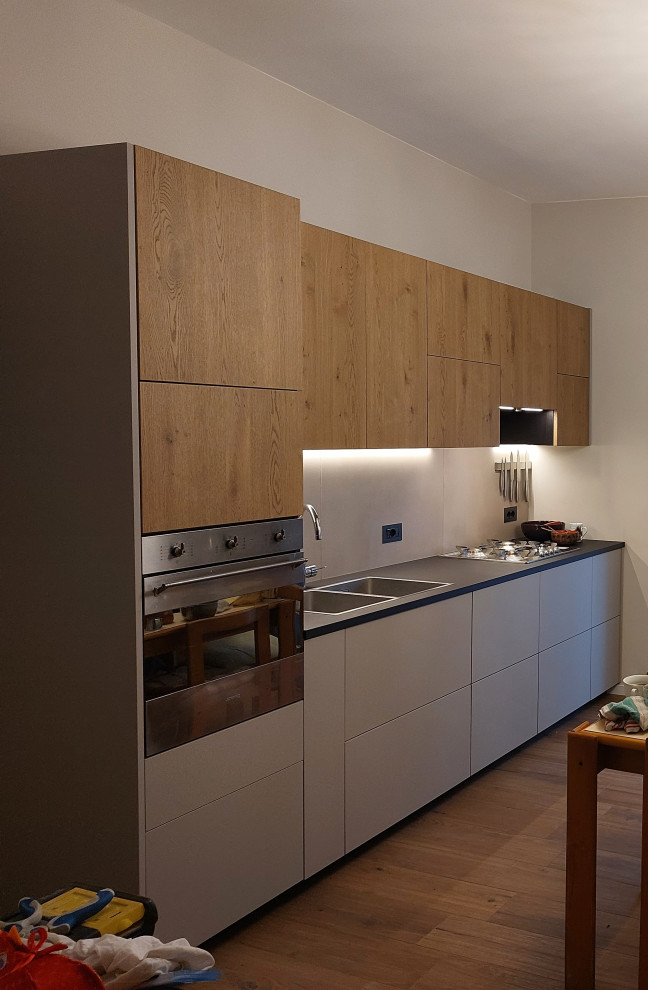 Example of a mid-sized trendy single-wall eat-in kitchen design in Naples
