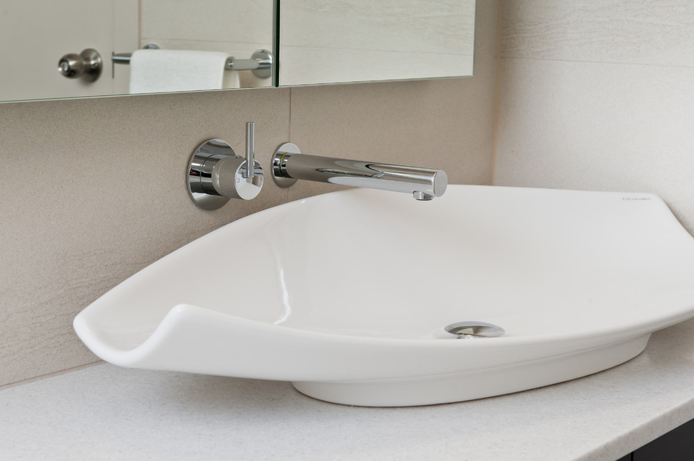 Inspiration for a mid-sized contemporary master bathroom in Other with black cabinets, a drop-in tub, an open shower, a one-piece toilet and beige walls.