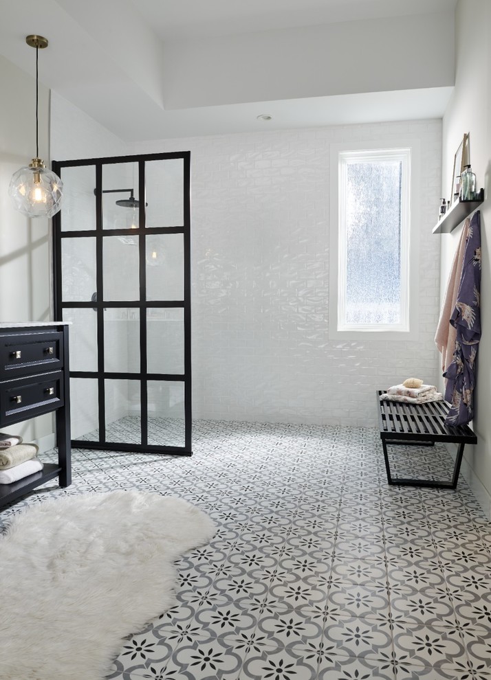 Photo of a mid-sized modern master bathroom in Orange County with raised-panel cabinets, black cabinets, a corner shower, white tile, subway tile, white walls, ceramic floors, a drop-in sink, marble benchtops, multi-coloured floor, an open shower and white benchtops.