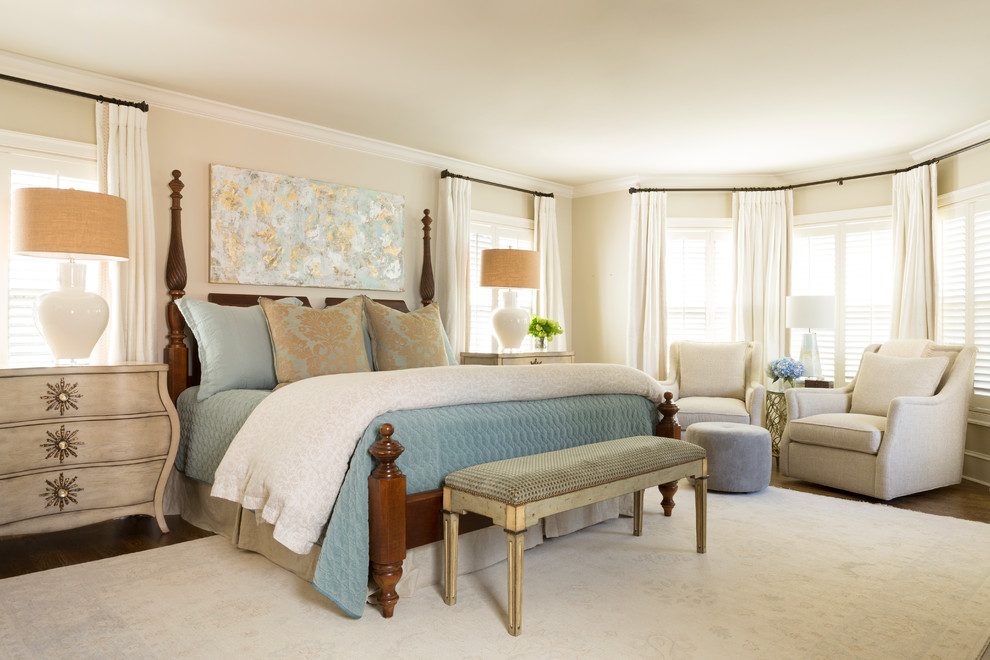 Photo of a traditional master bedroom in Little Rock with beige walls, dark hardwood floors and brown floor.