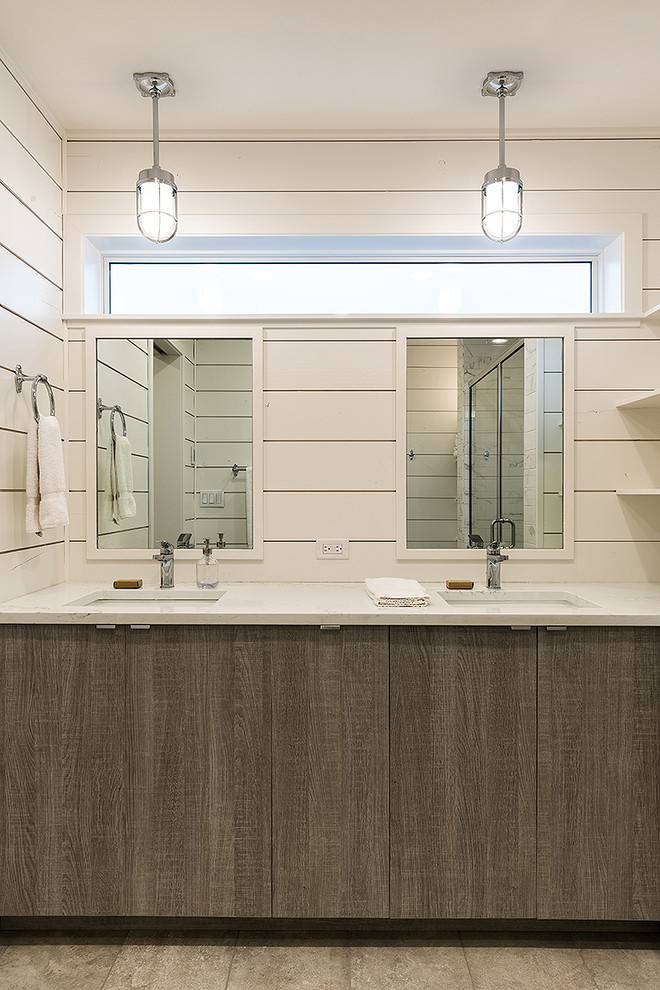 Inspiration for a large beach style master bathroom in Seattle with flat-panel cabinets, medium wood cabinets, a curbless shower, a one-piece toilet, white tile, ceramic tile, white walls, porcelain floors, an undermount sink, engineered quartz benchtops, grey floor, a shower curtain and white benchtops.