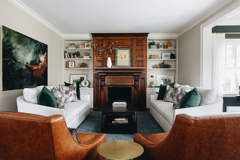 This is an example of a mid-sized traditional formal enclosed living room in Chicago with beige walls, medium hardwood floors, a standard fireplace, a stone fireplace surround and brown floor.