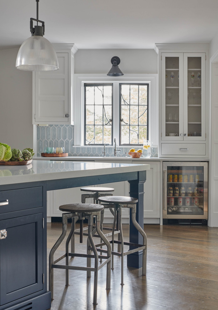 Kitchen - transitional kitchen idea with white cabinets, an island and stainless steel appliances