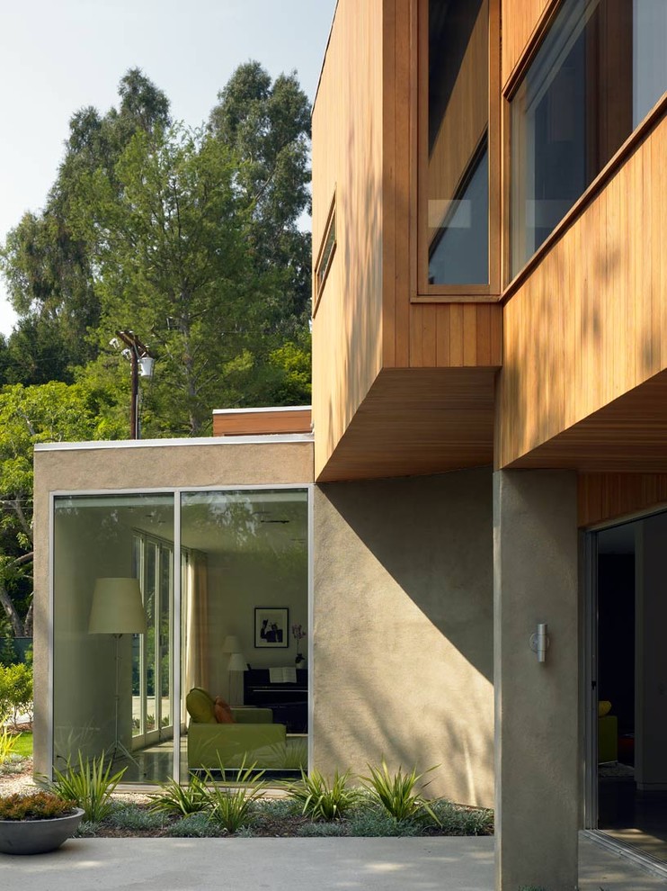 This is an example of a modern exterior in Los Angeles with wood siding.