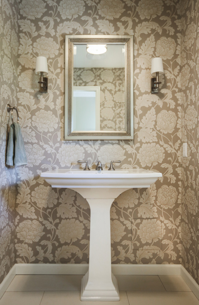 Inspiration for a transitional porcelain tile and beige floor powder room remodel with beige walls and a pedestal sink