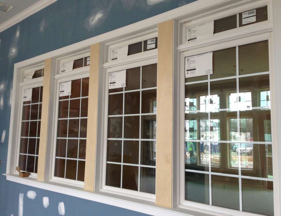 Example of a large transitional home design design with blue walls