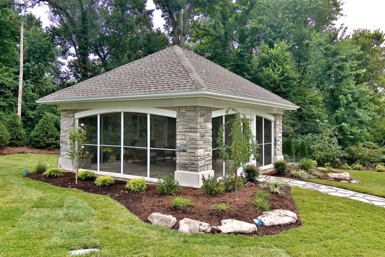 Inspiration for a large contemporary backyard patio in St Louis with natural stone pavers and a gazebo/cabana.