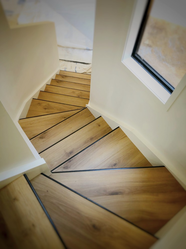 This is an example of a small contemporary floating staircase in Other.