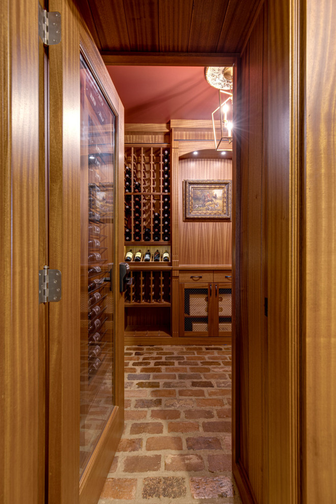 Secret passageway wine cellar. Basement layout with all mahogany racking.