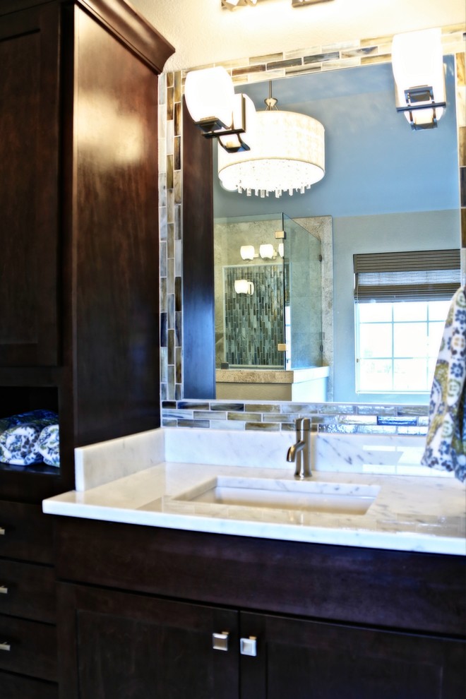 Drop-in bathtub - mid-sized transitional master gray tile porcelain tile drop-in bathtub idea in Dallas with an undermount sink, shaker cabinets, dark wood cabinets, marble countertops and gray walls