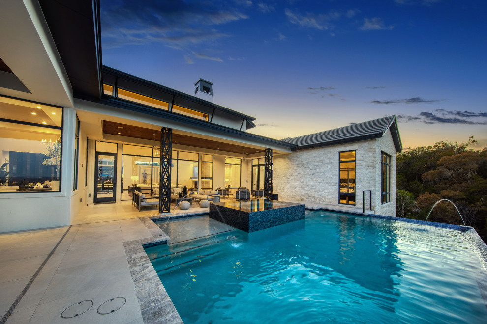 Inspiration for a transitional pool remodel in Austin