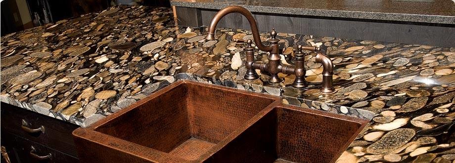Inspiration for a rustic kitchen remodel in Orange County with a double-bowl sink and dark wood cabinets