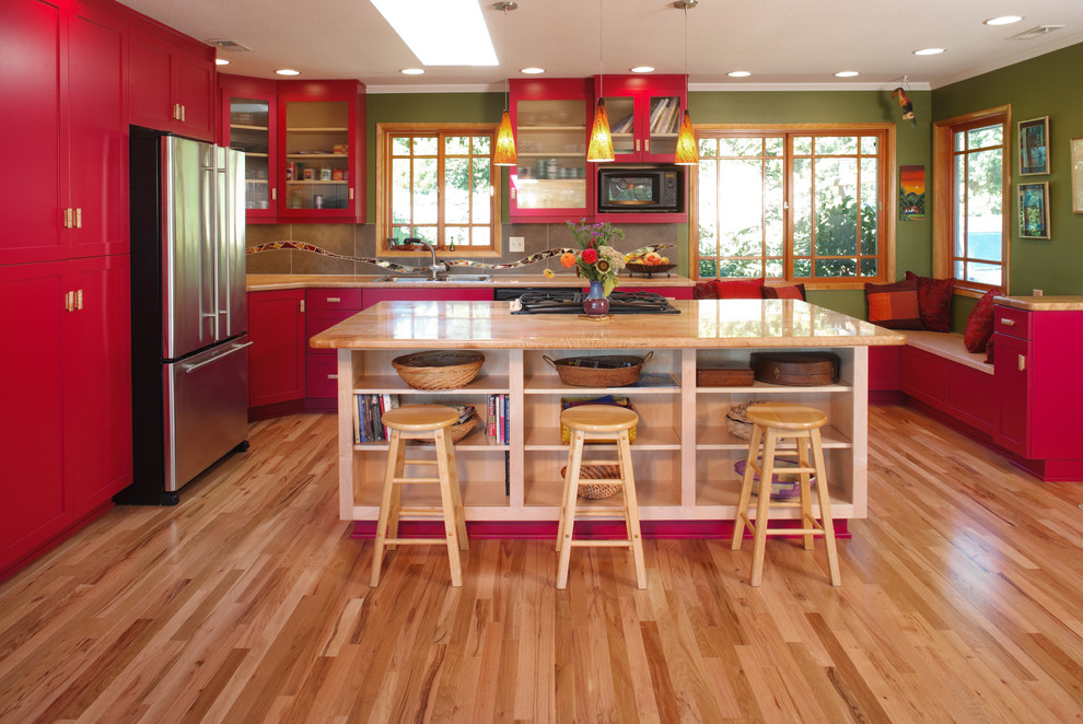 Transitional kitchen in Portland with red cabinets.