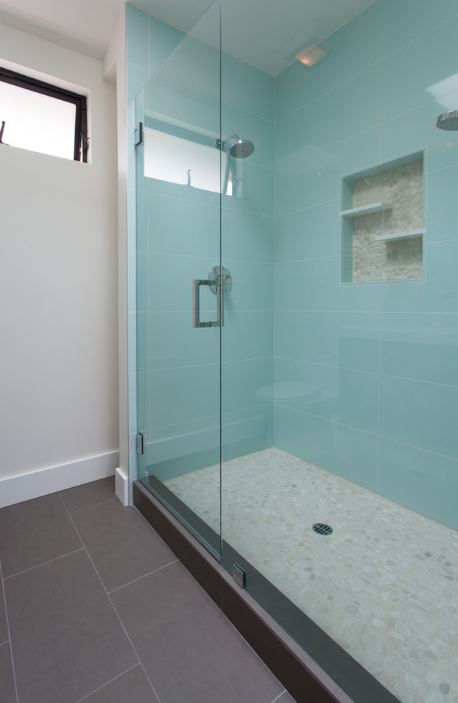 Photo of a mid-sized contemporary master bathroom in Orange County with flat-panel cabinets, an alcove shower, black tile, porcelain tile, blue walls and porcelain floors.
