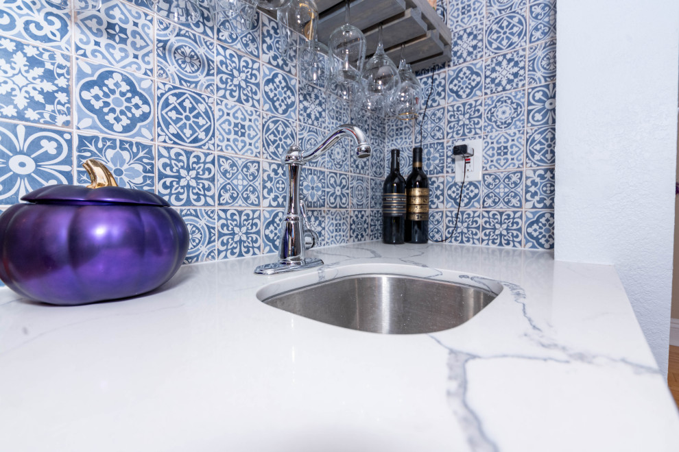 Enclosed kitchen - mid-sized u-shaped cement tile floor and multicolored floor enclosed kitchen idea in Los Angeles with a single-bowl sink, shaker cabinets, gray cabinets, quartzite countertops, white backsplash, subway tile backsplash, stainless steel appliances, no island and white countertops