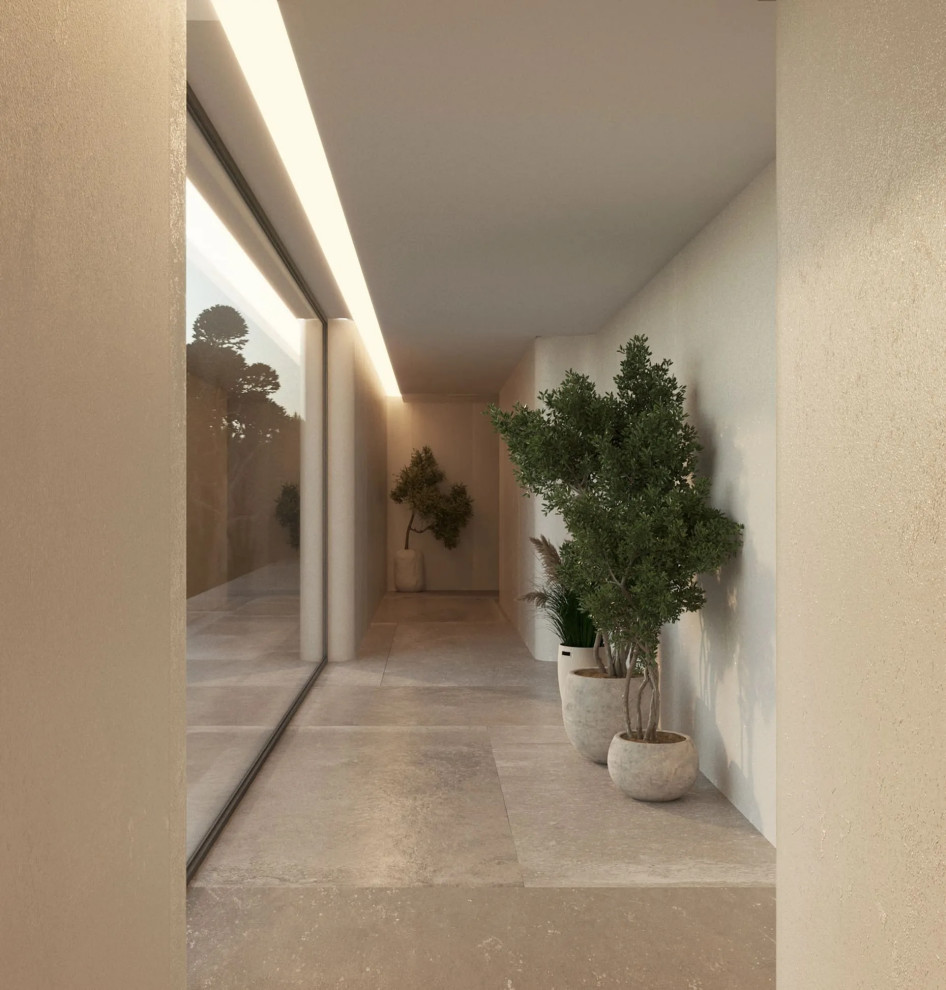На фото: коридор среднего размера в стиле модернизм с бежевыми стенами, мраморным полом и бежевым полом с
