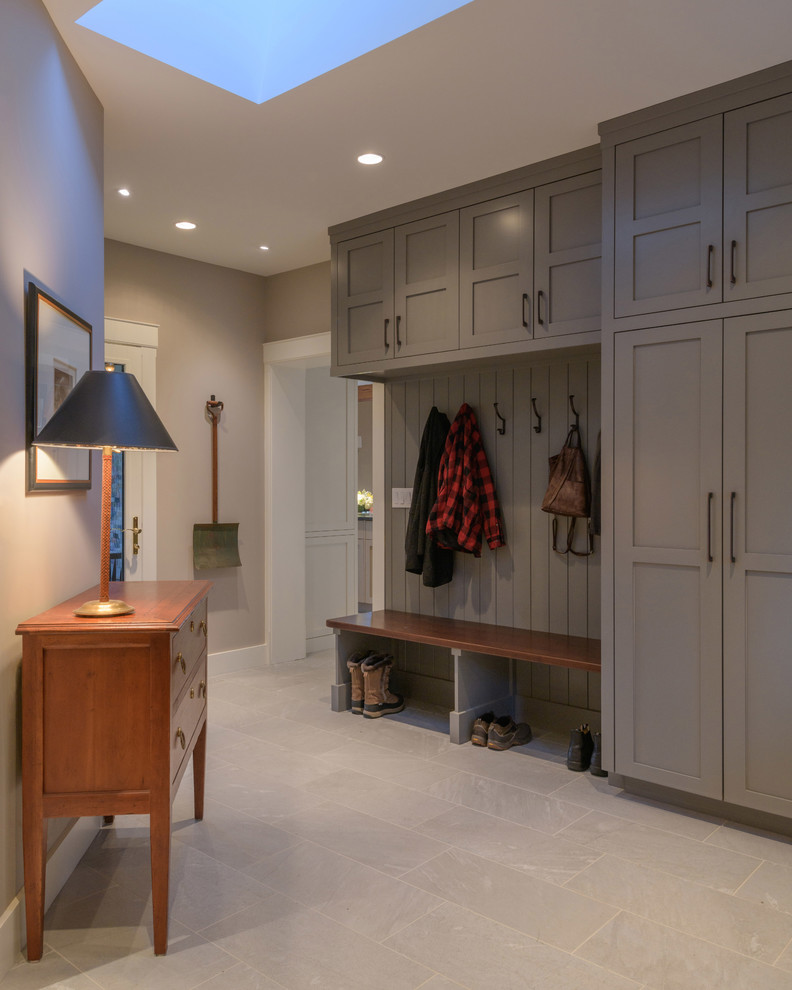 Design ideas for a large transitional mudroom in Other with grey walls, porcelain floors and grey floor.