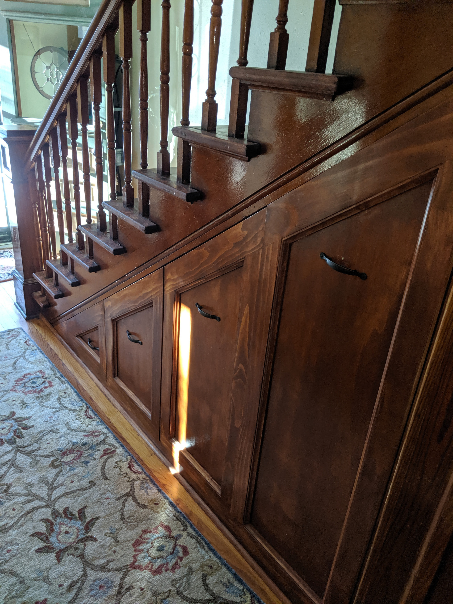 Entry hall closet built under stairs