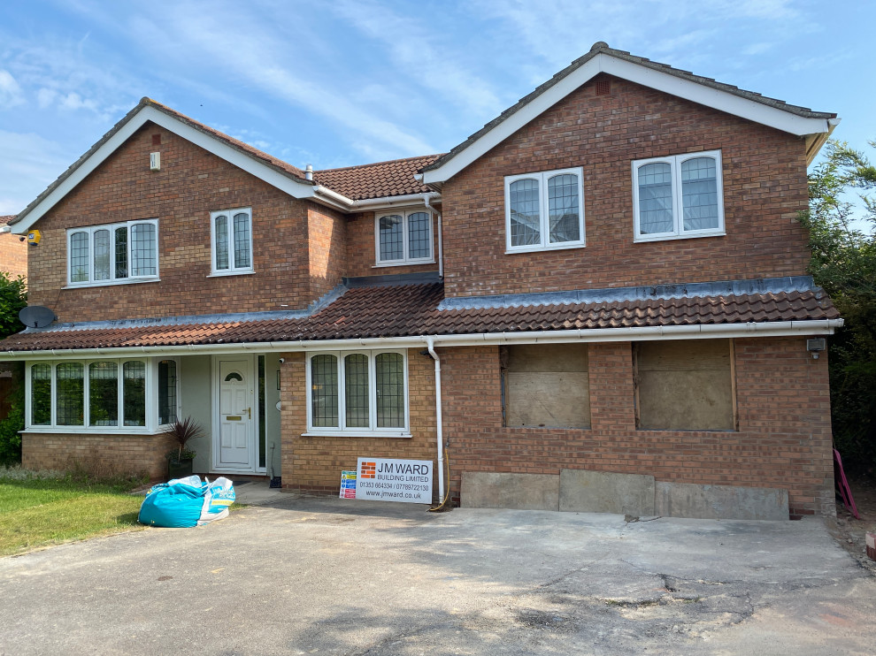 Hanging Christmas lights up high. Houzz UK