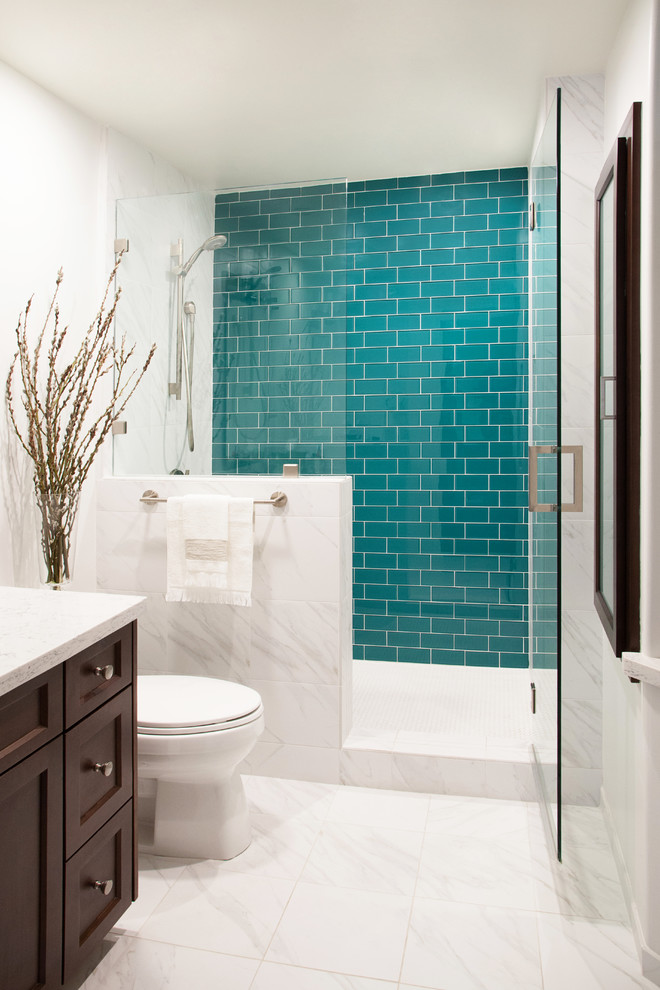 Design ideas for a mid-sized transitional bathroom in San Diego with an undermount sink, recessed-panel cabinets, dark wood cabinets, engineered quartz benchtops, an alcove shower, a one-piece toilet, white tile, ceramic tile, white walls and porcelain floors.