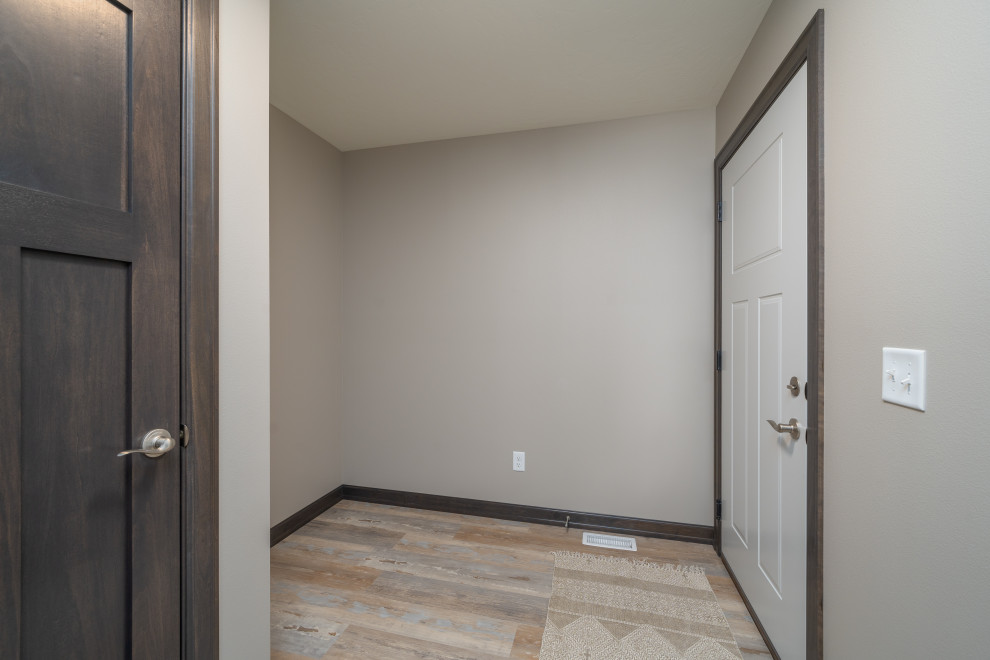 Mudroom - transitional vinyl floor and multicolored floor mudroom idea with gray walls and a white front door