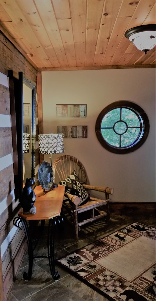 Foyer - mid-sized rustic slate floor foyer idea