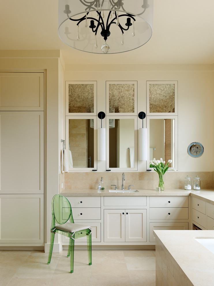 Photo of a transitional bathroom in San Francisco with an undermount sink, shaker cabinets, beige cabinets and beige tile.