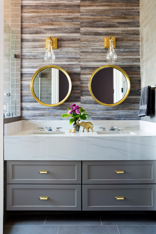 Inspiration for a mid-sized transitional master bathroom in DC Metro with flat-panel cabinets, grey cabinets, an alcove shower, a one-piece toilet, white tile, subway tile, white walls, porcelain floors, an integrated sink and marble benchtops.