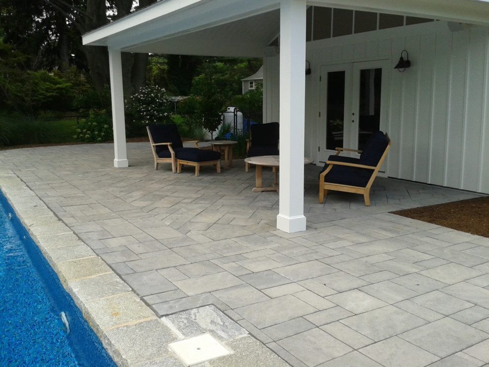 Design ideas for a large contemporary backyard kidney-shaped lap pool in Bridgeport with concrete pavers.