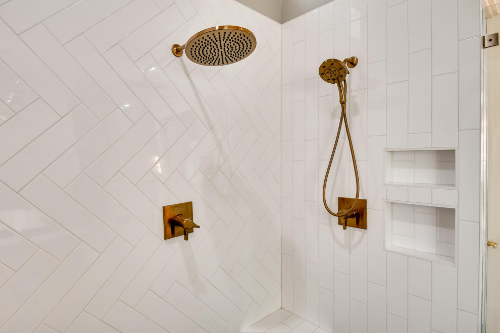 White subway tile with gold fixtures