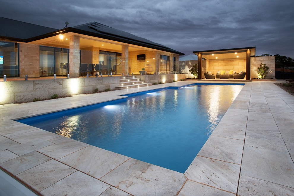 Large contemporary backyard rectangular pool in Adelaide with tile.