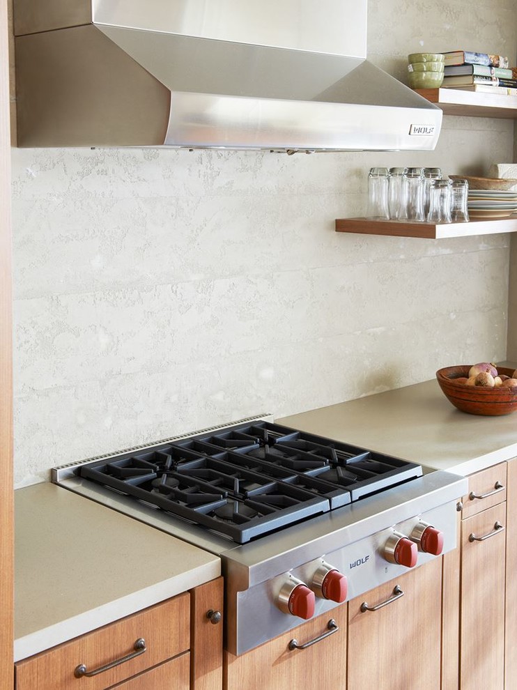 Open concept kitchen - mid-sized transitional open concept kitchen idea in Philadelphia with flat-panel cabinets, medium tone wood cabinets, quartz countertops, beige backsplash, cement tile backsplash, stainless steel appliances and beige countertops