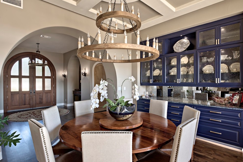 Photo of a large transitional dining room in Austin with beige walls and dark hardwood floors.