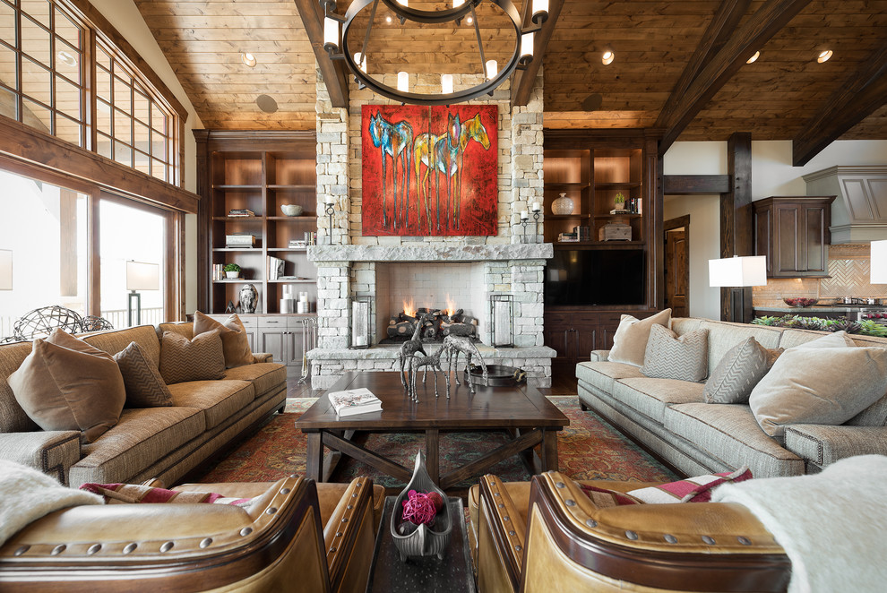 Inspiration for a large country open concept family room in Salt Lake City with a standard fireplace, a stone fireplace surround, white walls, dark hardwood floors and a built-in media wall.