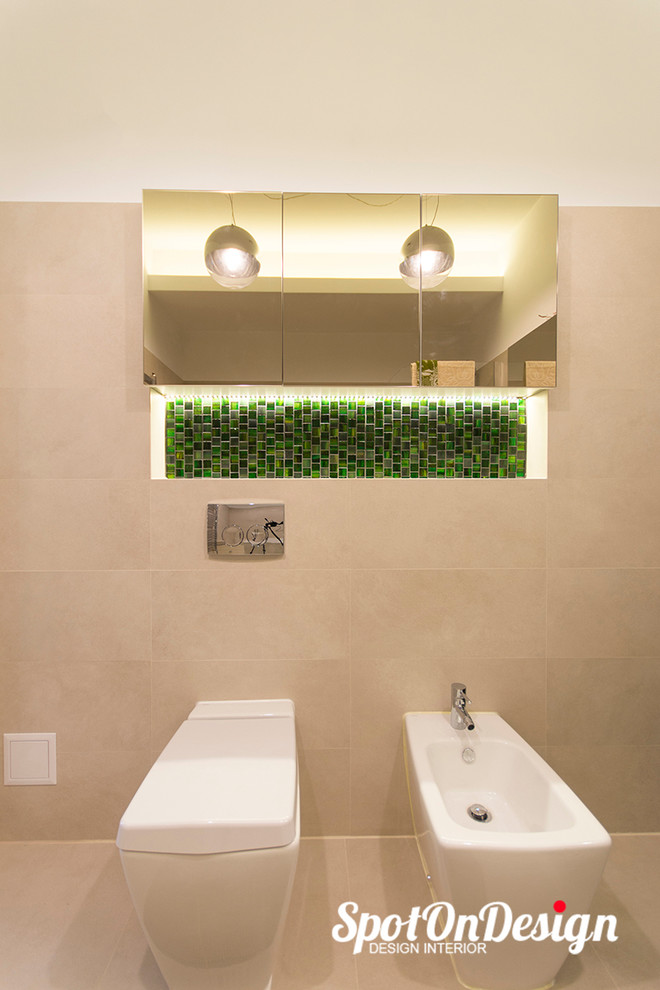Mid-sized modern kids bathroom in Other with flat-panel cabinets, grey cabinets, laminate benchtops, a shower/bathtub combo, a wall-mount toilet, beige tile, ceramic tile, white walls, ceramic floors and a vessel sink.