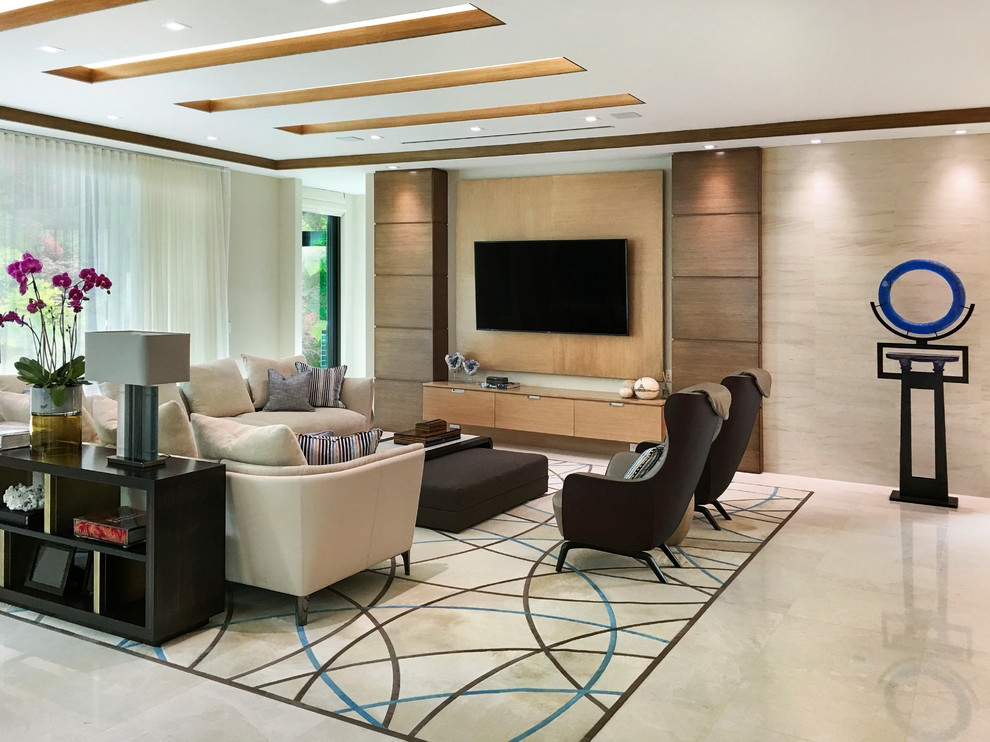 Design ideas for an expansive transitional open concept family room in Miami with beige walls, marble floors, a wall-mounted tv and beige floor.