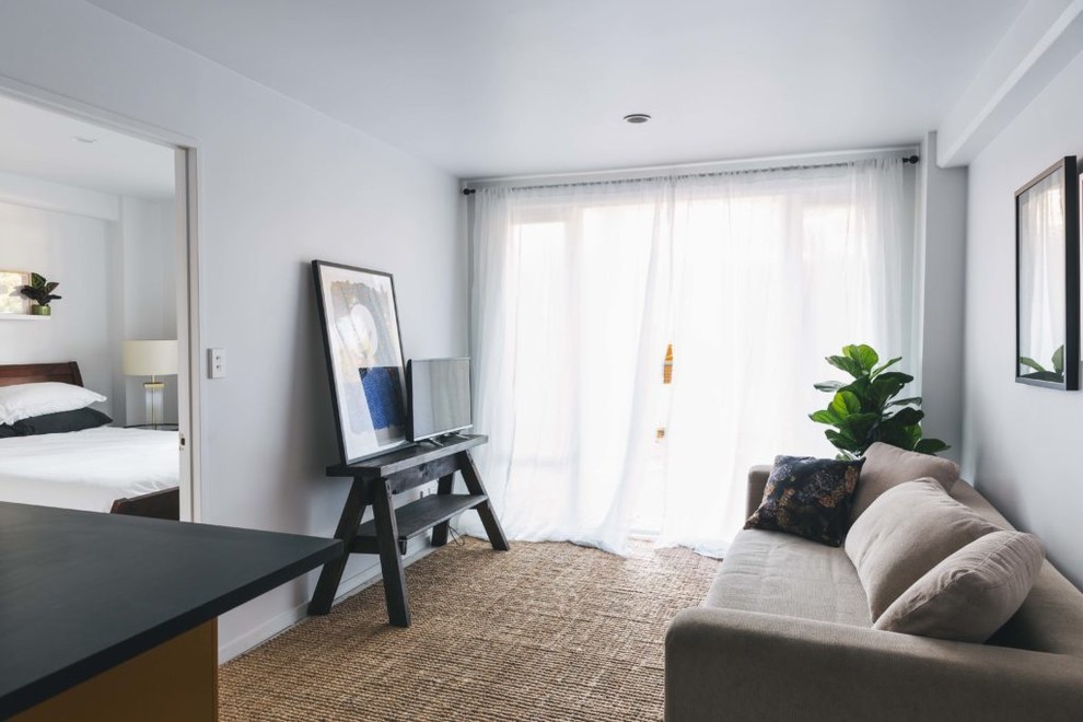 Inspiration for a Small shabby-chic style Open Concept living room in Auckland With White Walls, No Fireplace and a Freestanding TV.
