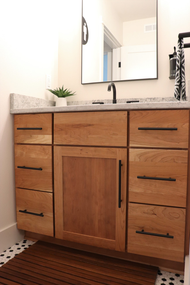 Large transitional l-shaped medium tone wood floor and brown floor open concept kitchen photo with a single-bowl sink, shaker cabinets, white cabinets, quartz countertops, gray backsplash, subway tile backsplash, stainless steel appliances, an island and white countertops
